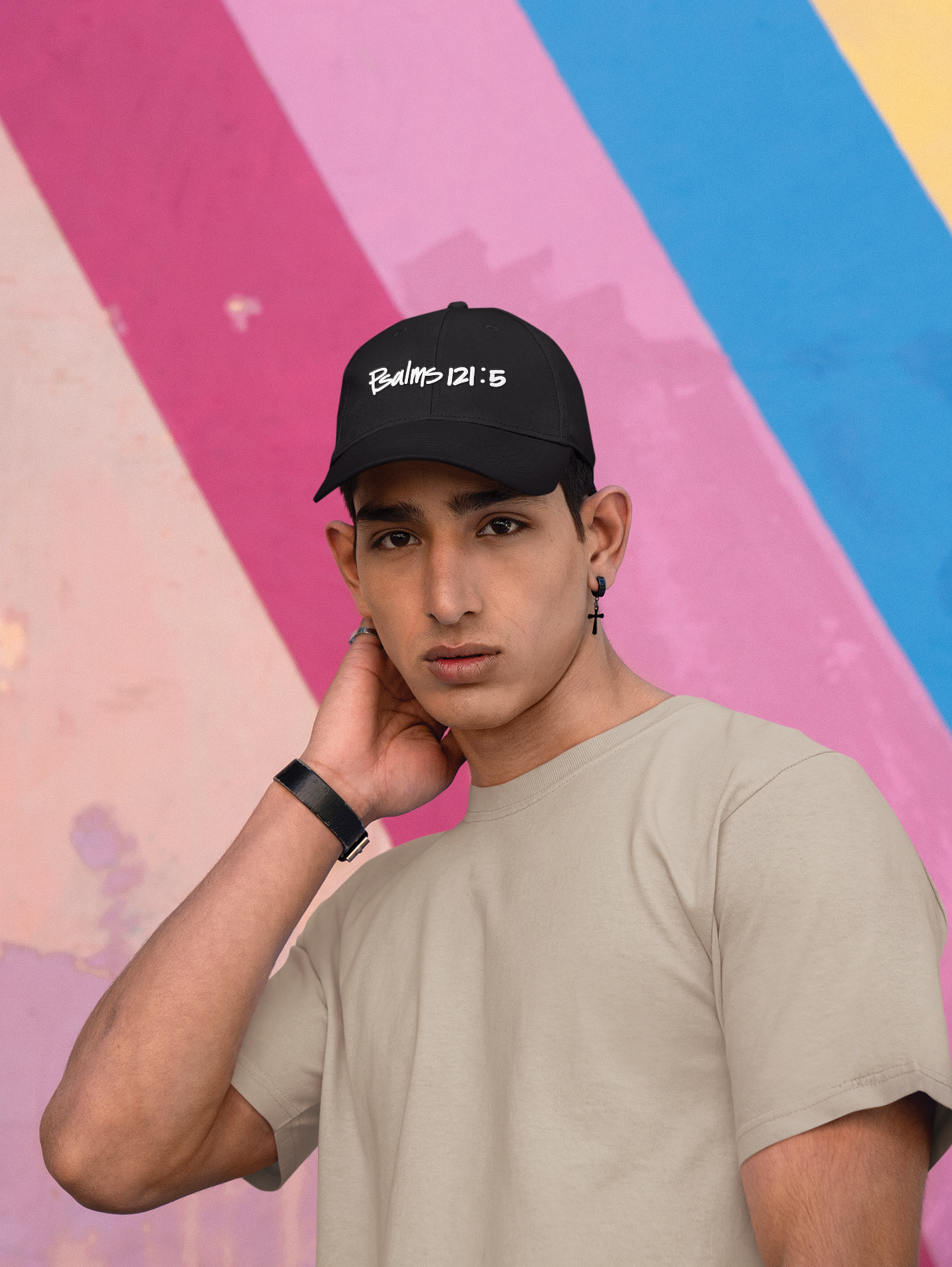 man in black cap with white writing on it